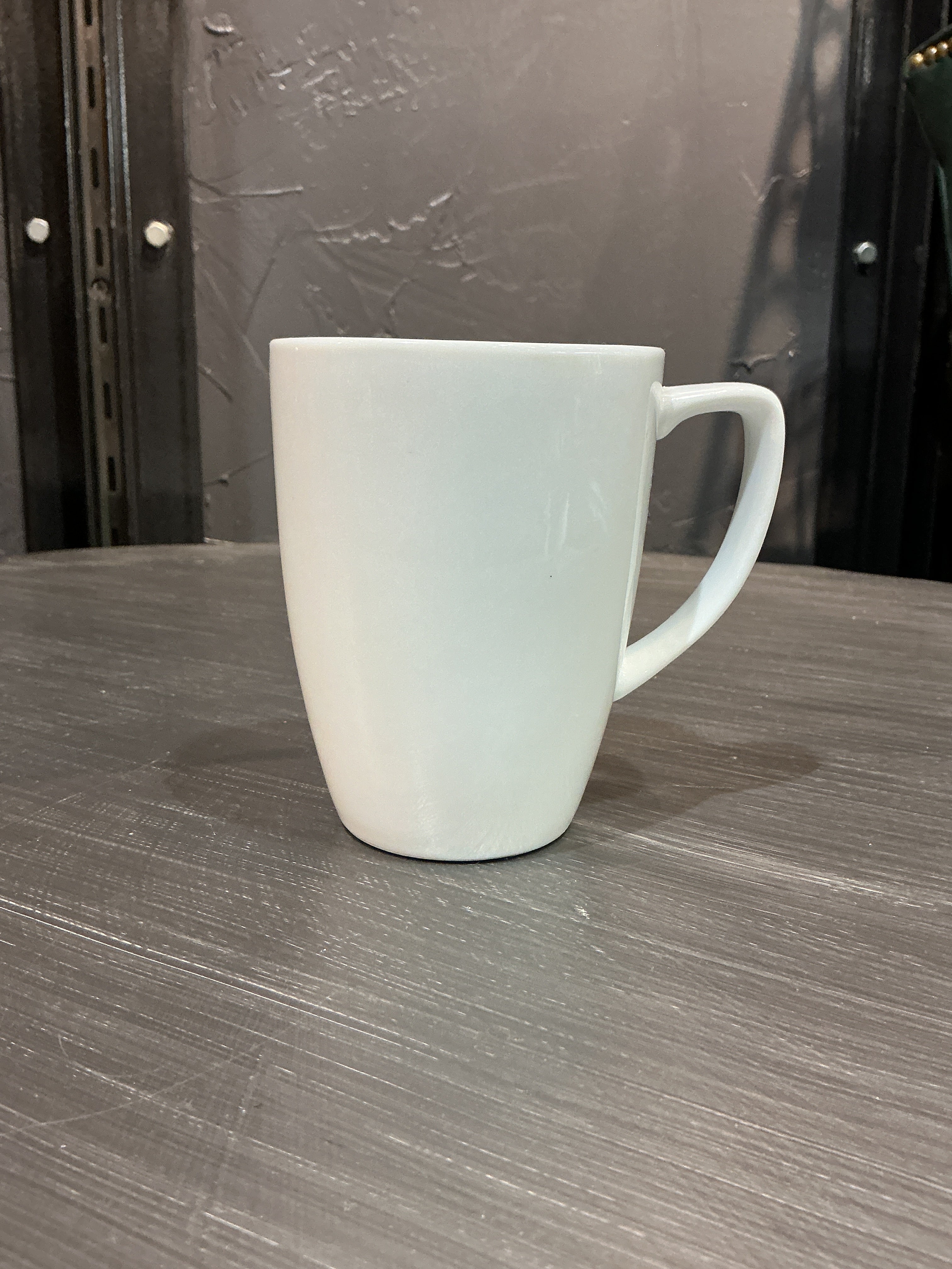 Plain white ceramic coffee mug