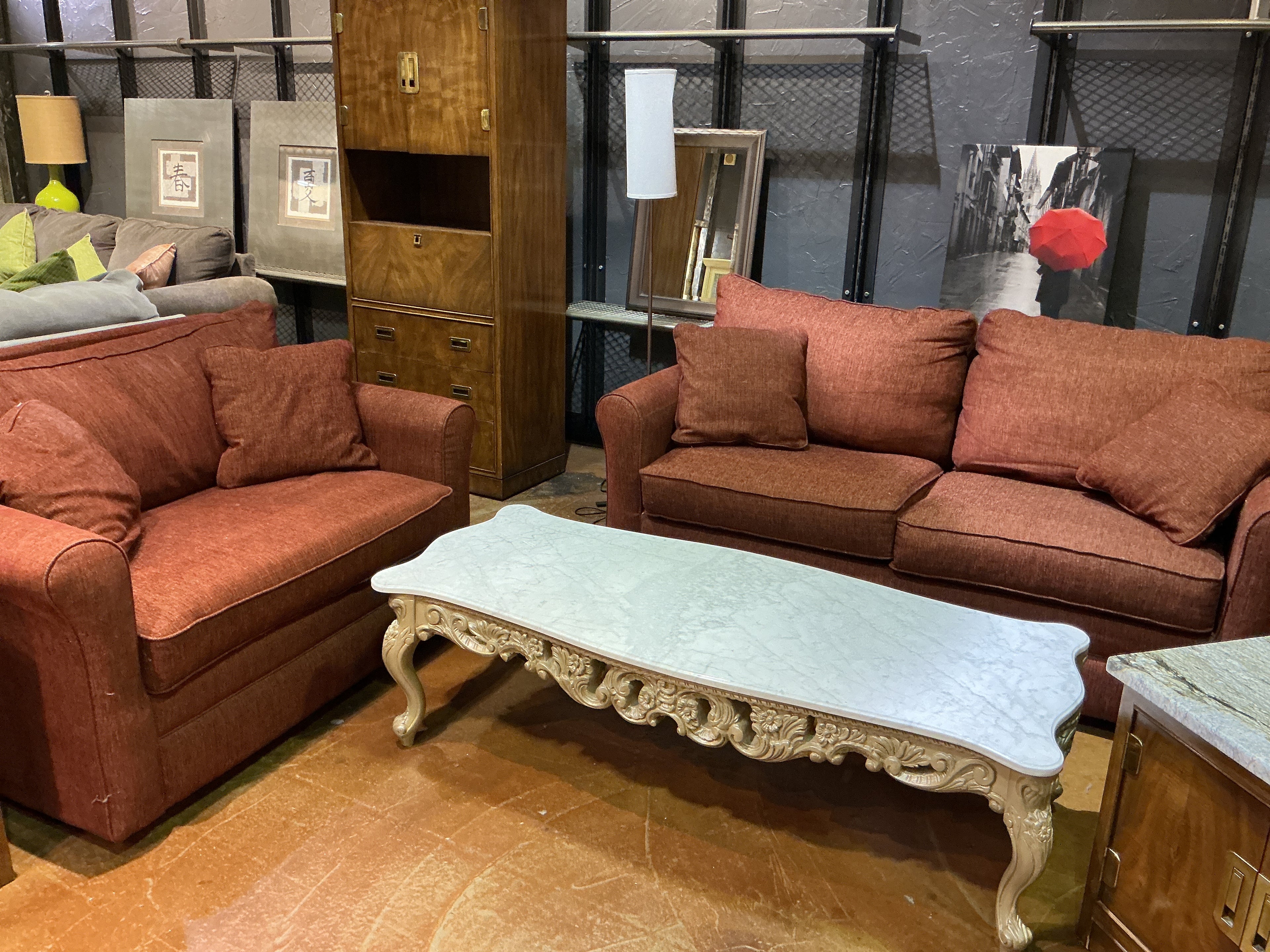 Burnt red couch and loveseat